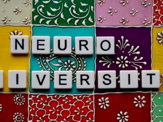 the word neuro university spelled with scrabble tiles