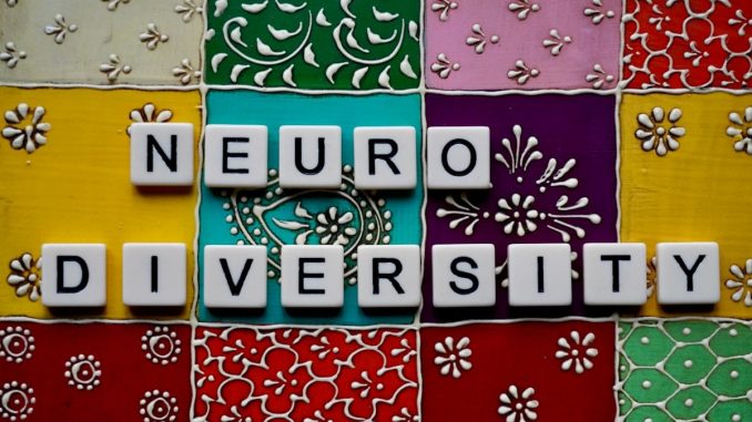 the word neuro university spelled with scrabble tiles