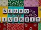 the word neuro university spelled with scrabble tiles
